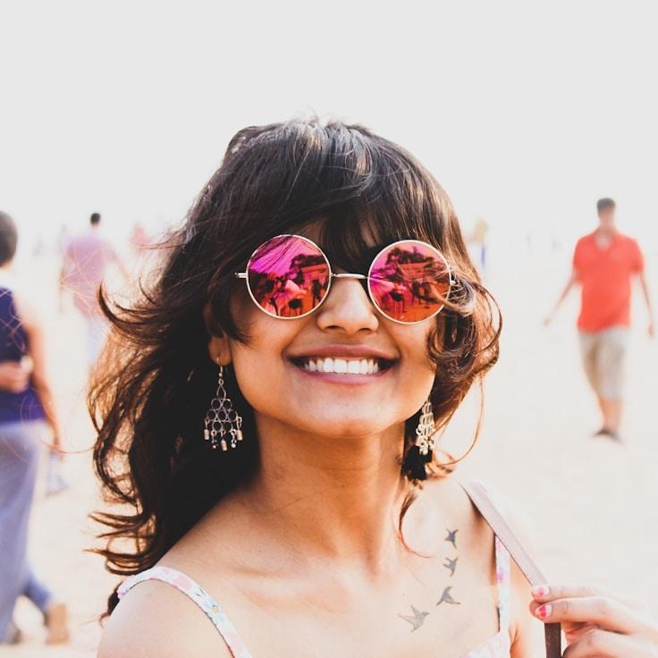 Kaveri Mehta, Lead Design Curator at Quiet Vale Harbor, reviewing corporate floral arrangements